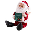 pére noël assis avec peluche et livre sonore et motorisé 35cm